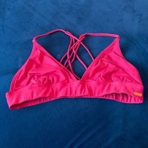 Hot pink Roxy bikini top with braided straps and criss cross back.